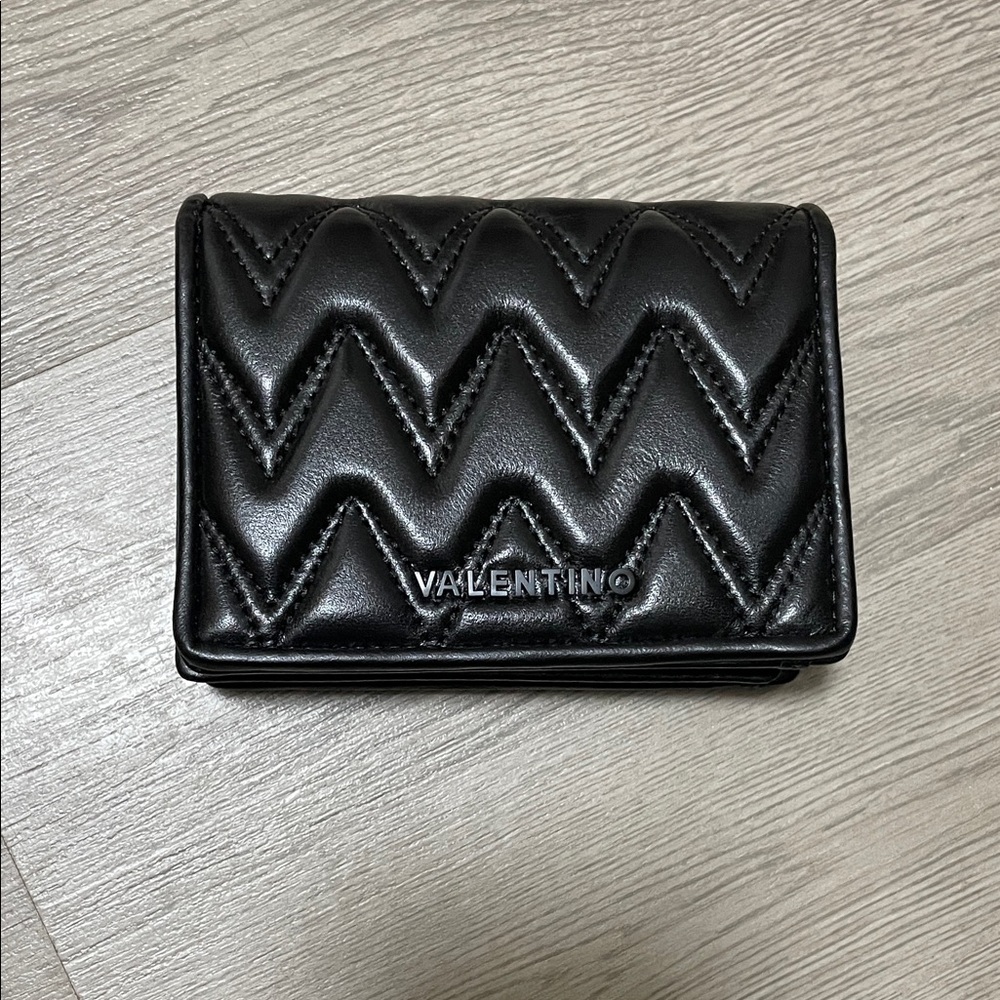 Mario Valentino Black Quilted Leather Trifold Wallet.